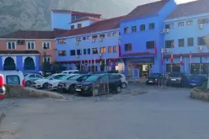 Guarded parking area near the entrance to Chefchaouen Medina in Morocco