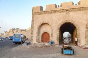 Essaouira medina blue cart porter transporting luggage Morocco